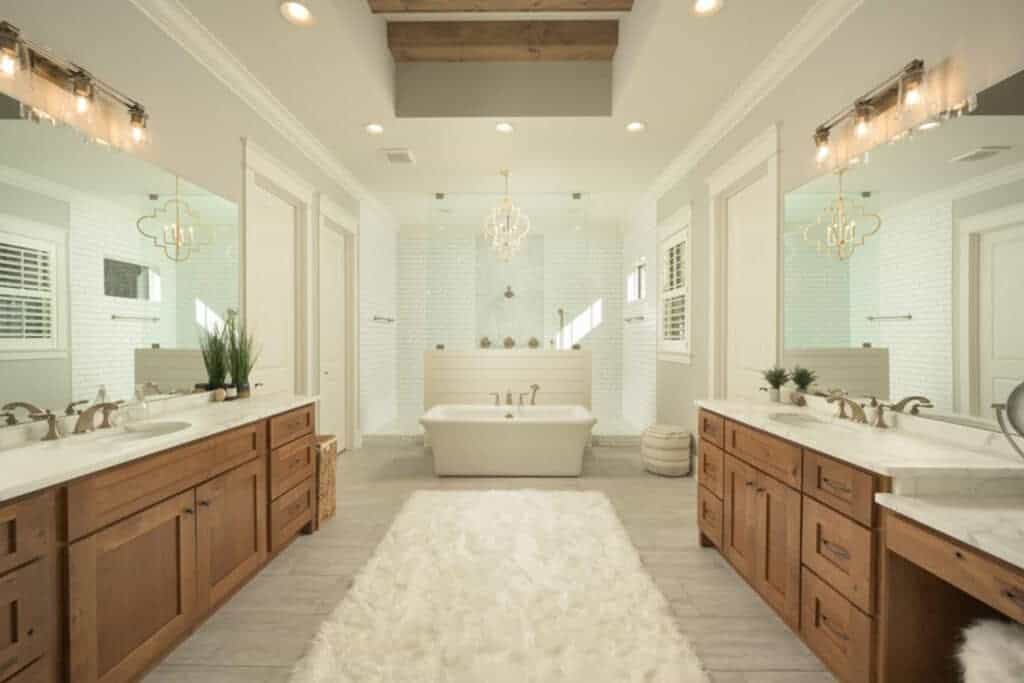 Double sink spa like bathroom with creamy and neutral colors